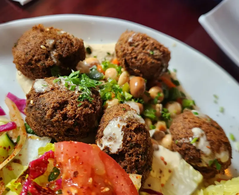 Falafel on salad with tahini