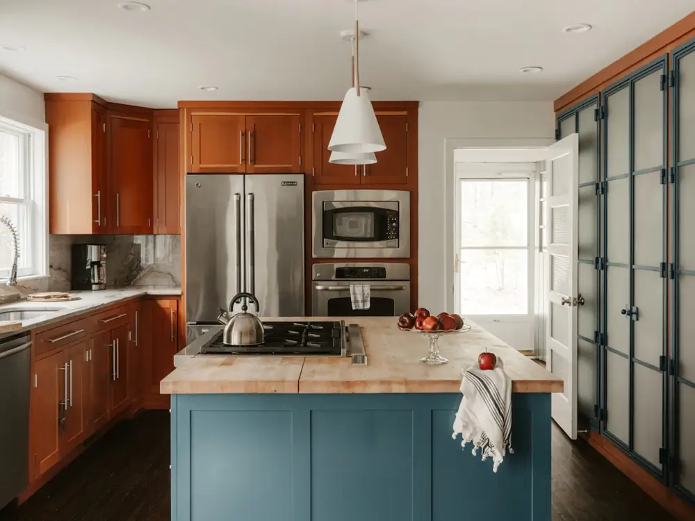 Painted two-pack kitchen island in deep blue with a timber benchtop