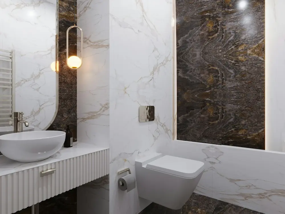 Ensuite with white Carrara marble walls and a dark book-matched stone feature wall